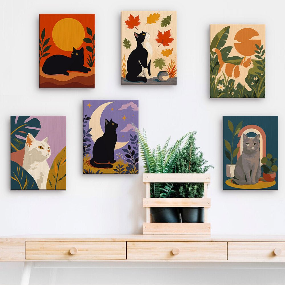 Black Cat Moods mini paintings displayed on a wall