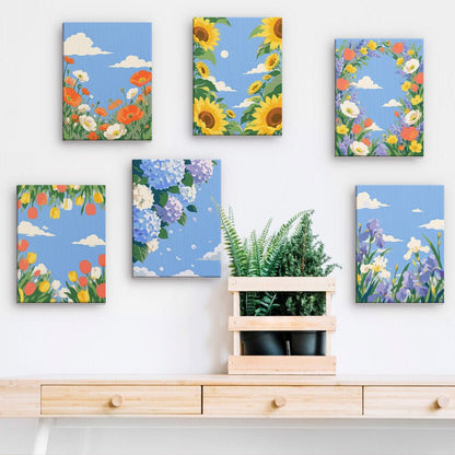 Blue Sky Blooms mini paintings displayed on a wall