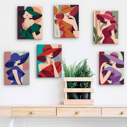 Bold Hat Ladies mini paintings displayed on a wall