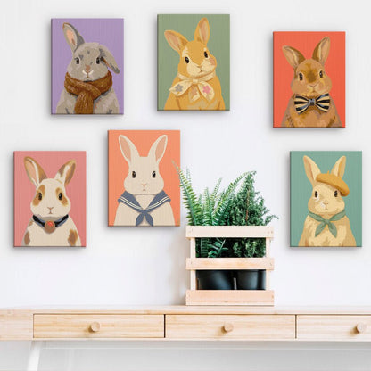 Bunny Friends mini paintings displayed on a wall
