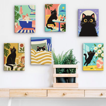 Cat Mischief mini paintings displayed on a wall