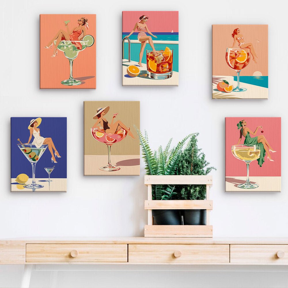 Cocktail Pin-Ups mini paintings displayed on a wall