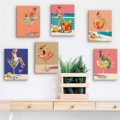 Cocktail Pin-Ups mini paintings displayed on a wall