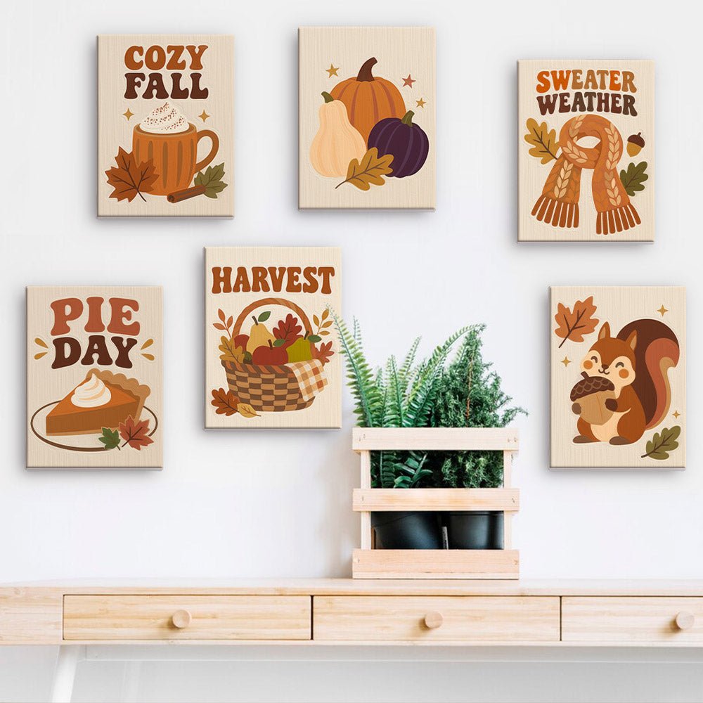 Cozy Fall mini paintings displayed on a wall