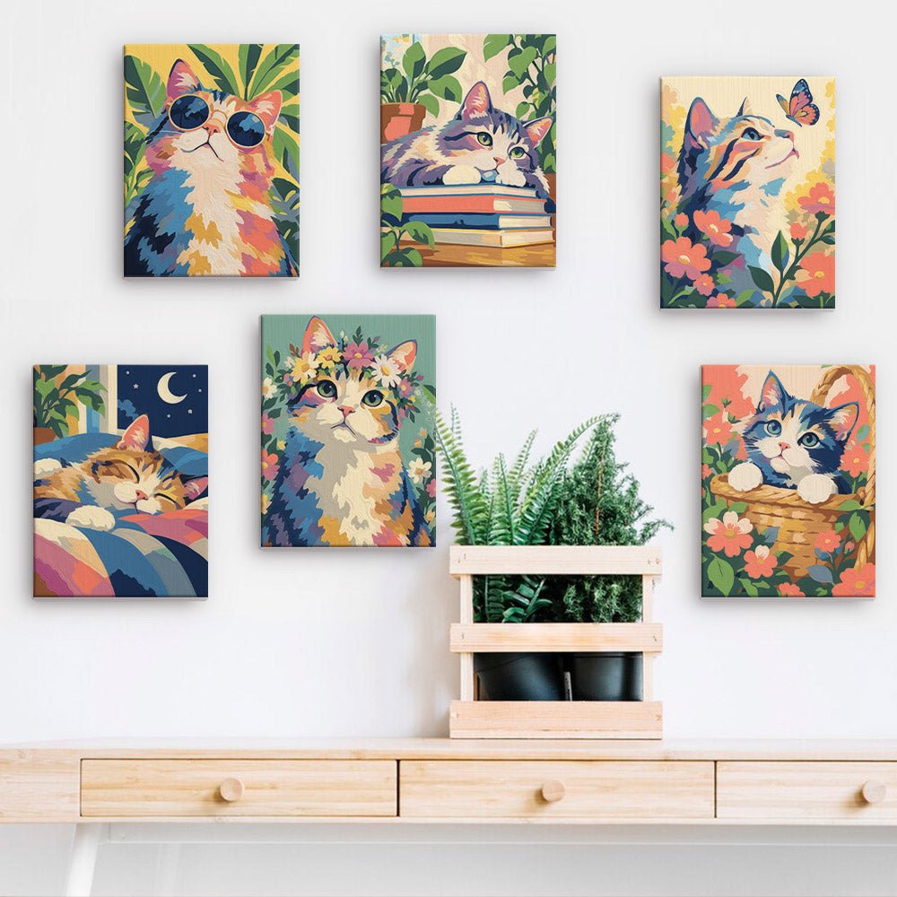 Dreamy Kitties mini paintings displayed on a wall
