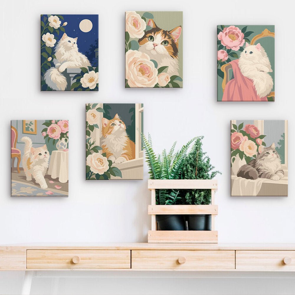 Fluffy Cat Cuddles mini paintings displayed on a wall