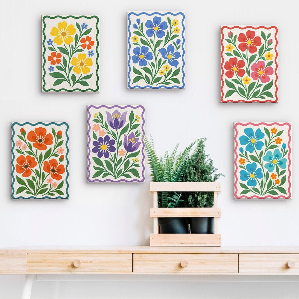 Folk Flowers mini paintings displayed on a wall