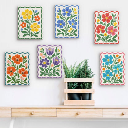 Folk Flowers mini paintings displayed on a wall