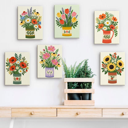 Garden Flower Tins mini paintings displayed on a wall