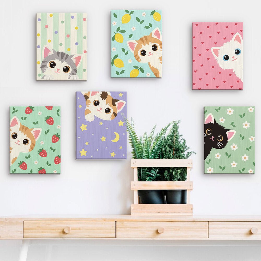 Kitten Cuties mini paintings displayed on a wall
