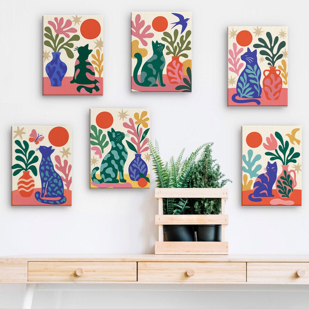 Matisse Cats mini paintings displayed on a wall