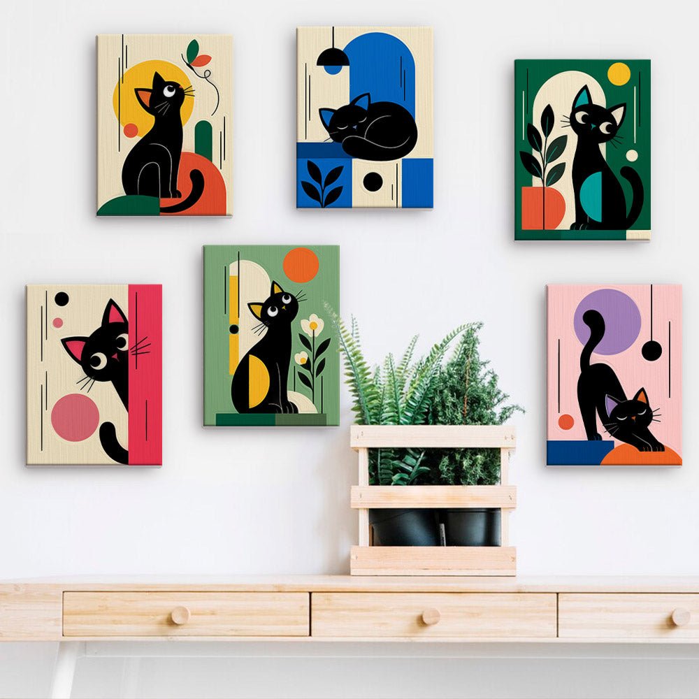 Mid-Century Cats mini paintings displayed on a wall