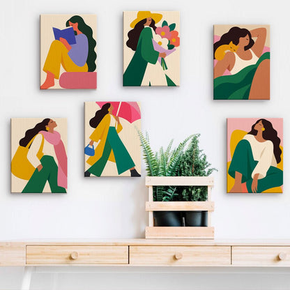 Modern Muse mini paintings displayed on a wall