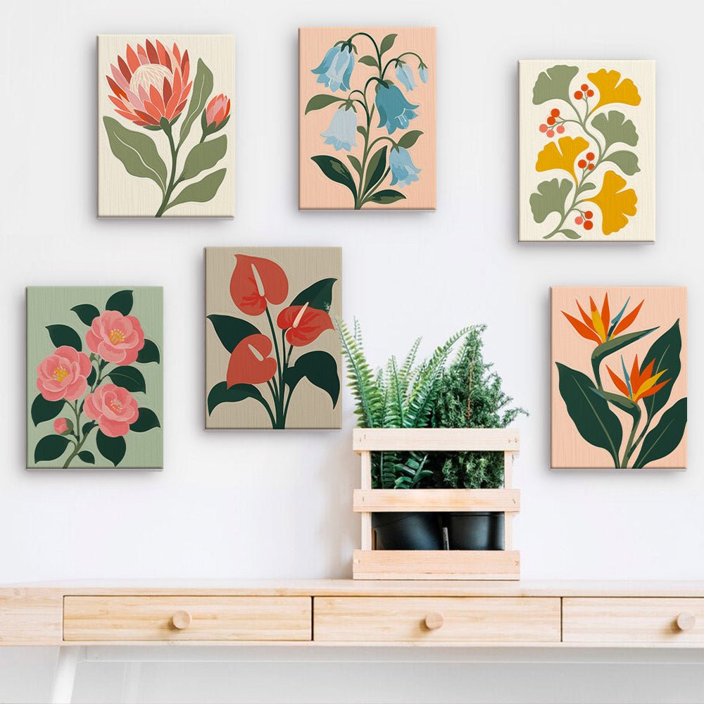 Protea and Paradise mini paintings displayed on a wall