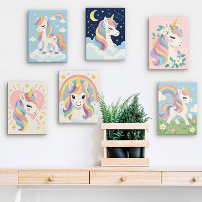 Rainbow Unicorns mini paintings displayed on a wall