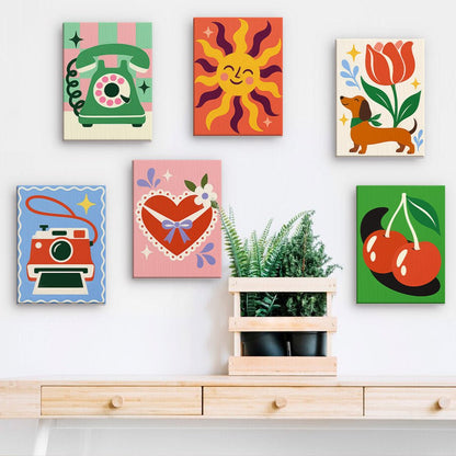 Retro Pop Icons mini paintings displayed on a wall