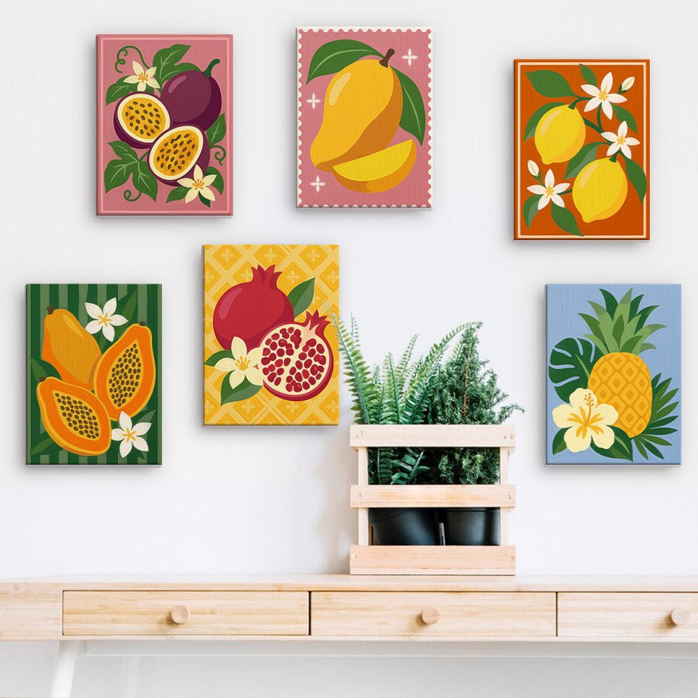 Tropical Fruit Stamps mini paintings displayed on a wall