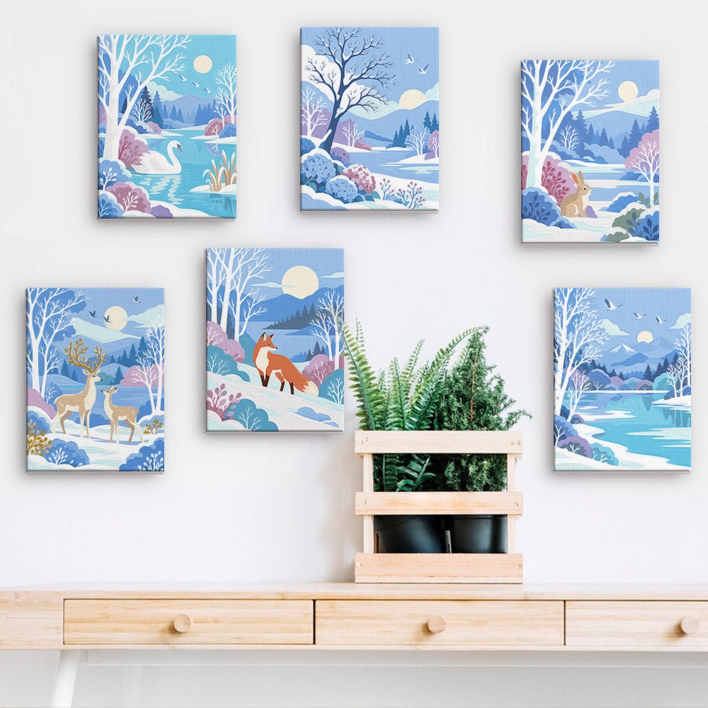 Winter Wonderland mini paintings displayed on a wall